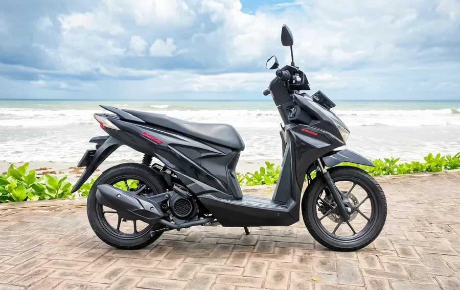 Black and grey 2020-generation Honda Beat 110 automatic scooter with slim step-through body and 14-inch wheels