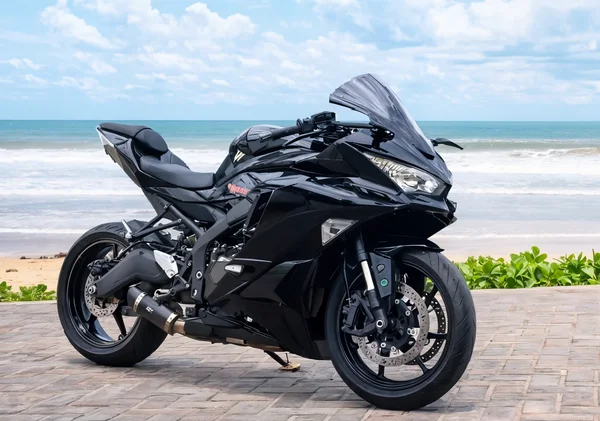Black Kawasaki Ninja ZX-25RR 250cc inline-four sport bike with full fairings, dark windscreen and raised tail