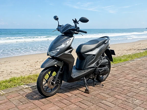 Black and grey 2020-generation Honda Beat 110 automatic scooter with slim step-through body and 14-inch wheels