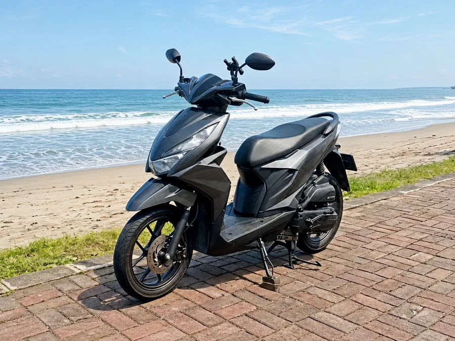 Black and grey 2020-generation Honda Beat 110 automatic scooter with slim step-through body and 14-inch wheels