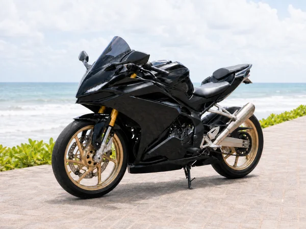 Black-and-gold Honda CBR250RR MC22 classic 250cc inline-four sport bike with full fairings